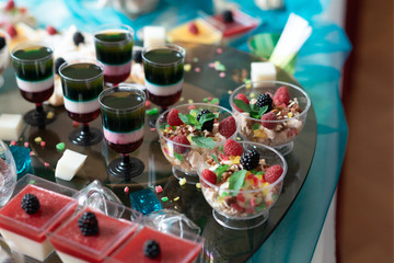 Luxurious desserts and drinks at the buffet table. Shallow depth of field.