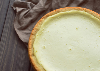 homemade cottage cheese pie on dark flax napkin background