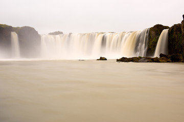 Long exposure photo of waterfall, view of the Godafoss waterfall in northern Iceland, Europe.