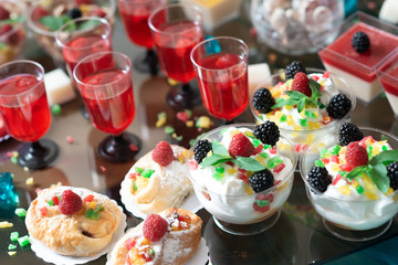 Luxurious desserts and drinks at the buffet table. Shallow depth of field.