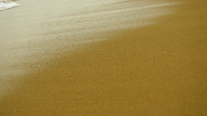 Seascape. Sea wave breaking on sandy beach of Mediterranean coastline. Greece. 4K