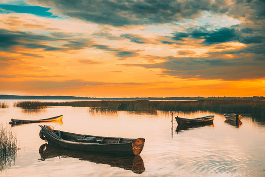 Braslaw Or Braslau, Vitebsk Voblast, Belarus. Wooden Rowing Fishing Boats In Beautiful Summer Sunset On The Dryvyaty Lake. This Is The Largest Lake Of Braslav Lakes. Typical Nature Of Belarus