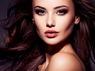 Face of the beautiful sexy woman with long brown hair