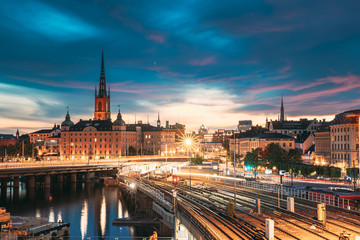 Stockholm, Sweden. Scenic View Of Stockholm Skyline At Summer Evening. Famous Popular Destination Scenic Place. Riddarholm Church And Subway Railway