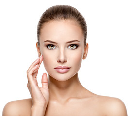 Fototapeta premium Beautiful face of the young pretty woman with fresh skin