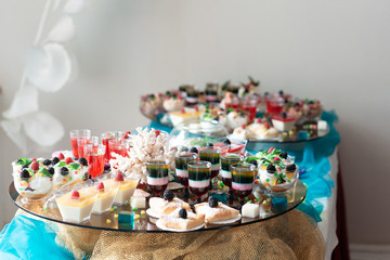 Luxurious desserts and drinks at the buffet table. Shallow depth of field.