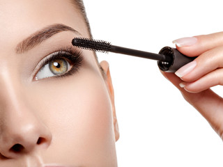 Obraz premium women eye with long black eyelashes and makeup brush