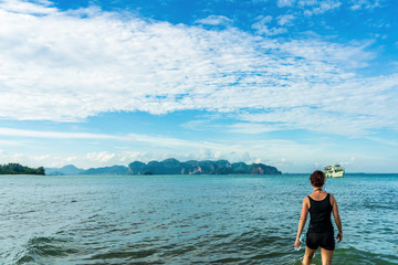 young cute hipster girl travelling at beautiful blue sky paradise tropical  coast beach PP Island Krabi Phuket Thailand guiding idea for long weekend  female relax rest woman women planning life