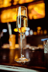 champagne in a glass against the background of the bar