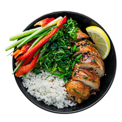 Delicious Buddha bowl with teriyaki chicken, fresh vegetables and basmati rice isolated on white background. Top view, directly above shot.