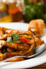 Boeuf, Stroganow, Strogonow. Classic, Russian beef stew. Served on a white plate. Front view. Natural background.