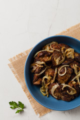 Fried chicken liver with onions.