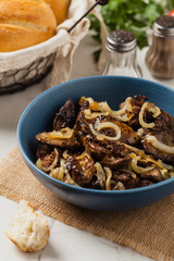 Fried chicken liver with onions.