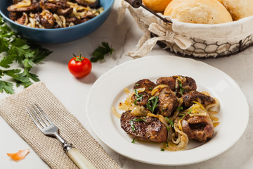 Fried chicken liver with onions.