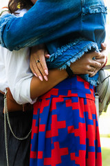 Young women are having fun on the green park in the evening.