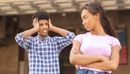 Obraz premium Relationship problems. Teenage couple standing outside after quarrel
