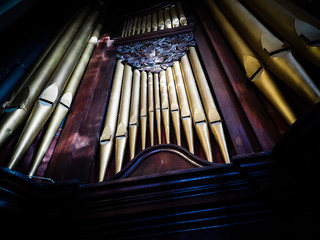 Golden organ pipes in an old church