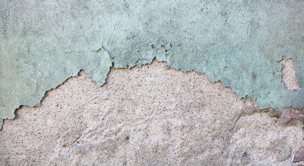 Two fragments of the house vintage wall are covered with green and gray  aged broken  plaster