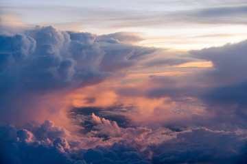 Dramatic sky with orange, blue, dark clouds