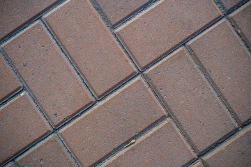 Texture of paving slabs overgrown with grass. Background image of a stratum stone