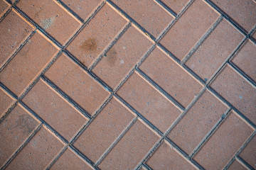 Texture of paving slabs overgrown with grass. Background image of a stratum stone