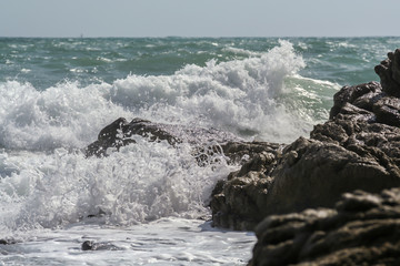 Fototapeta premium 2011.05.08, Phuket, Thailand. Ocean waves crashing on the rocks. Nature of Asia.