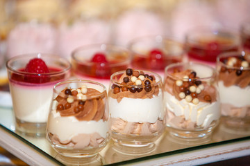 Colorful and Decorative Desserts And Pastry with fruits, mousse, biscuits Served On A Wedding Party