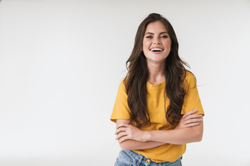 Positive emotional young emotional woman posing isolated over white wall background.