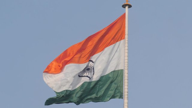 slow motion clip of the indian flag flying at the wagah border in amritsar, india-  originally 180p