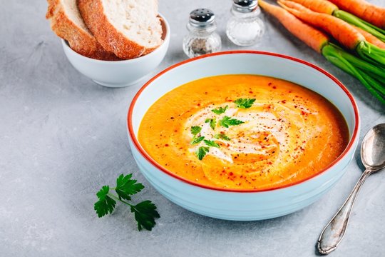 Carrot and pumpkin cream soup with parsley
