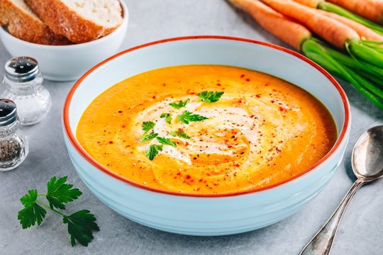 Carrot and pumpkin cream soup with parsley