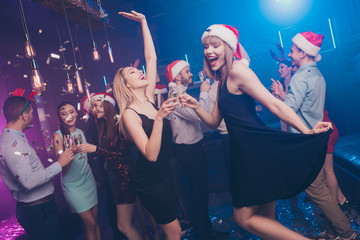 Portrait of nice attractive smart stylish cheerful cheery positive excited glad dreamy ladies and guys having fun rest relax feast festal celebratory at modern luxury fogged lights nightclub