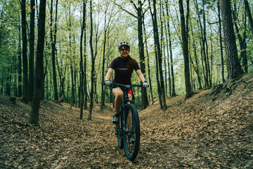 Women is riding on bicycle.