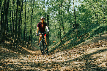 Women is riding on bicycle.