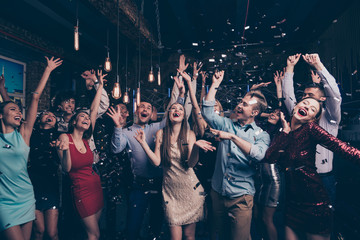 Nice-looking attractive glamorous elegant stylish cheerful positive girls and guys having fun bachelor graduate dream amusement event in fashionable luxury place nightclub indoors