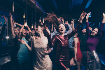 Nice gorgeous lovely chic attractive glamorous cheerful glad positive stylish girls and guys buddy fellow having fun weekend solemn celebratory festive feast in fashionable luxury place nightclub