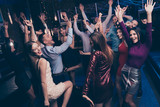 Nice-looking attractive glamorous lovely cheerful glad positive stylish chic graceful ladies and gentlemen having fun tradition dj set edm in fashionable luxury place nightclub indoors