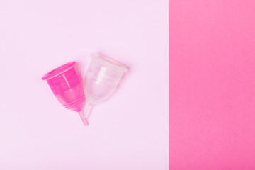 Two menstrual cups close-up on a pink background. Copy space. Zero waste concept, eco-friendly lifestyle, reduced consumption