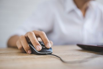 Close up of male hands are using computer mounts.