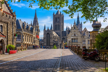 Medieval city of Gent (Ghent) in Flanders with Saint Nicholas Church and Gent Town Hall, Belgium....