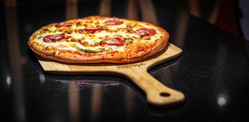 pizza in the black table 