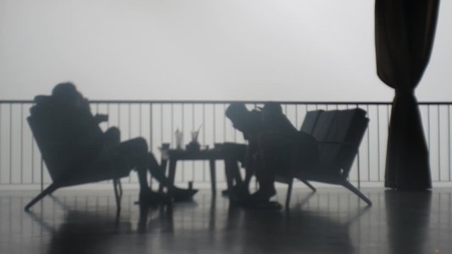 Tourists relaxing on terrace