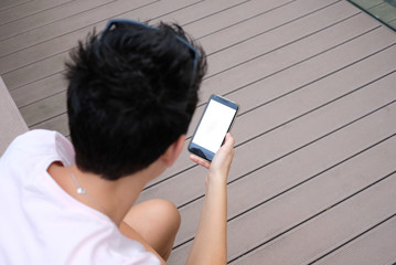 girl looking at her smartphone