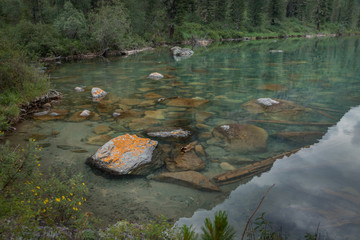 reflection at mountain`s lake of kalagash valley