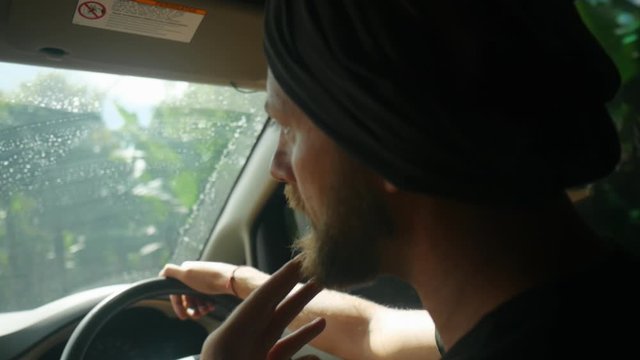 Man in turban driving car