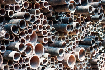 Pipes are not arranged neatly. Construction material texture.