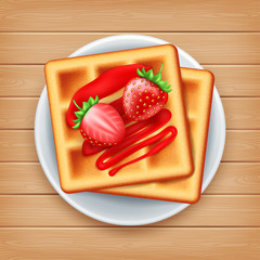 Plate of belgian waffle with strawberries on wood background, top view