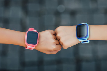 Child using smartwatch, wearable children tracking gadget with touch screen and voice service, electronic wristband for children.