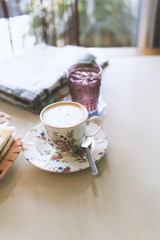 Obraz na płótnie Canvas Hot coffee, latte with newspapers. Breakfast at a coffee shop.warm tone