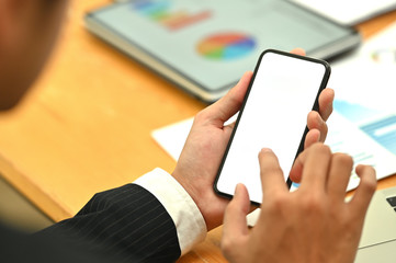 Top view Businessman using mockup smartphone.